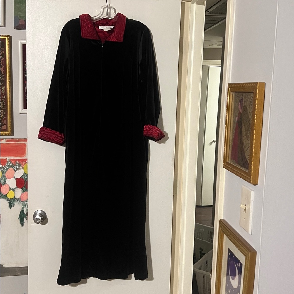 Cinema Etoile black velour with red quilted satin detail. Front zip closure.